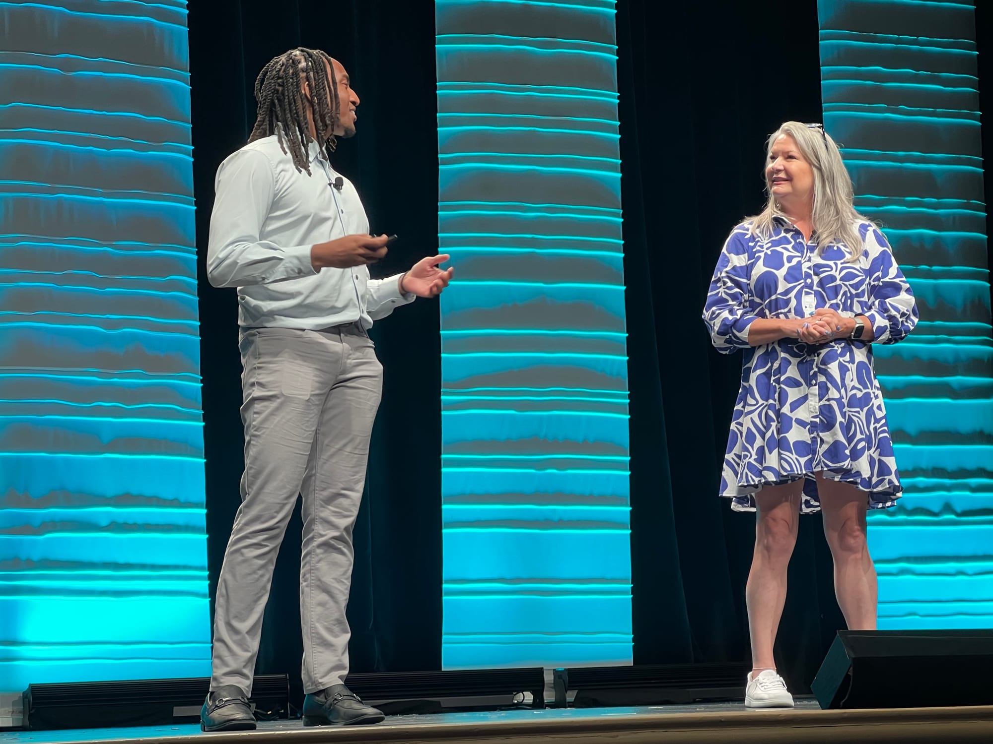 Toggle co-founder Matthew Wade and Largay Travel president Amanda Klimak presenting together on stage at the Virtuoso Travel Tech Summit in Las Vegas.